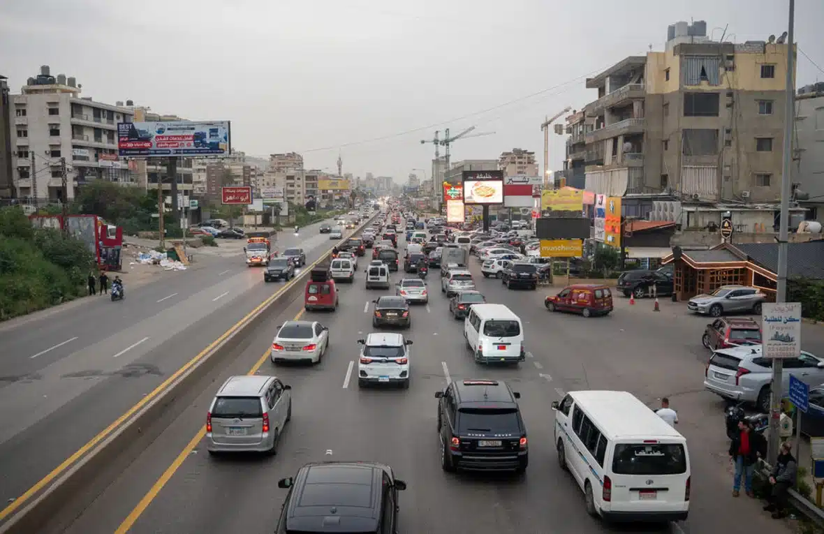 The photo shows a street packed with cars heading in one direction, while the traffic from the opposite direction is very light.