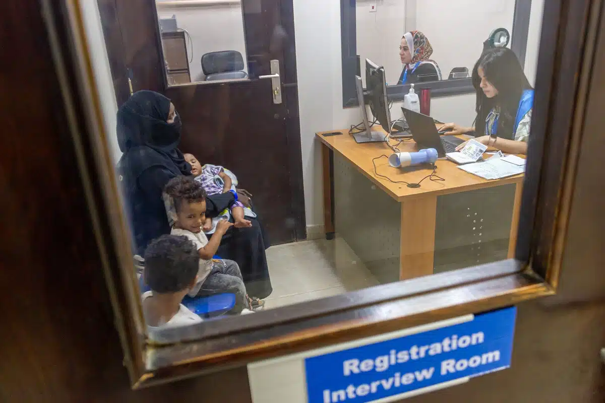 A Sudanese mother and her children attend a registration interview with UNHCR staff in Cairo, Egypt. © UNHCR/Jaime Giménez